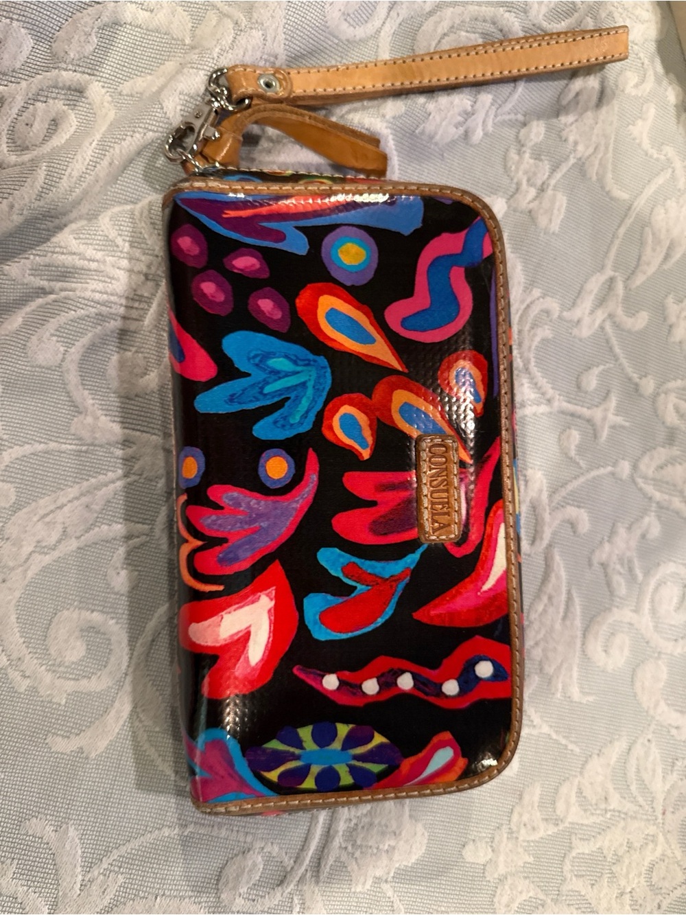 Consuela Black Floral-Abstract Zip Wristlet with Tan Strap